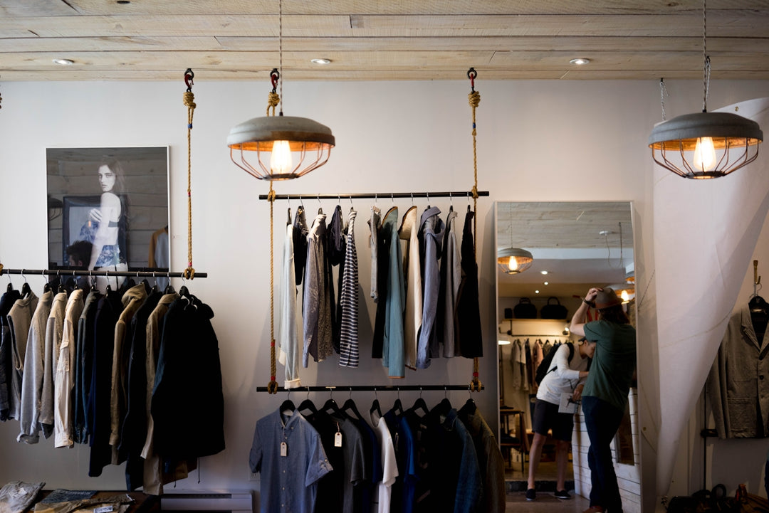 clothing boutique interior with hanging racks