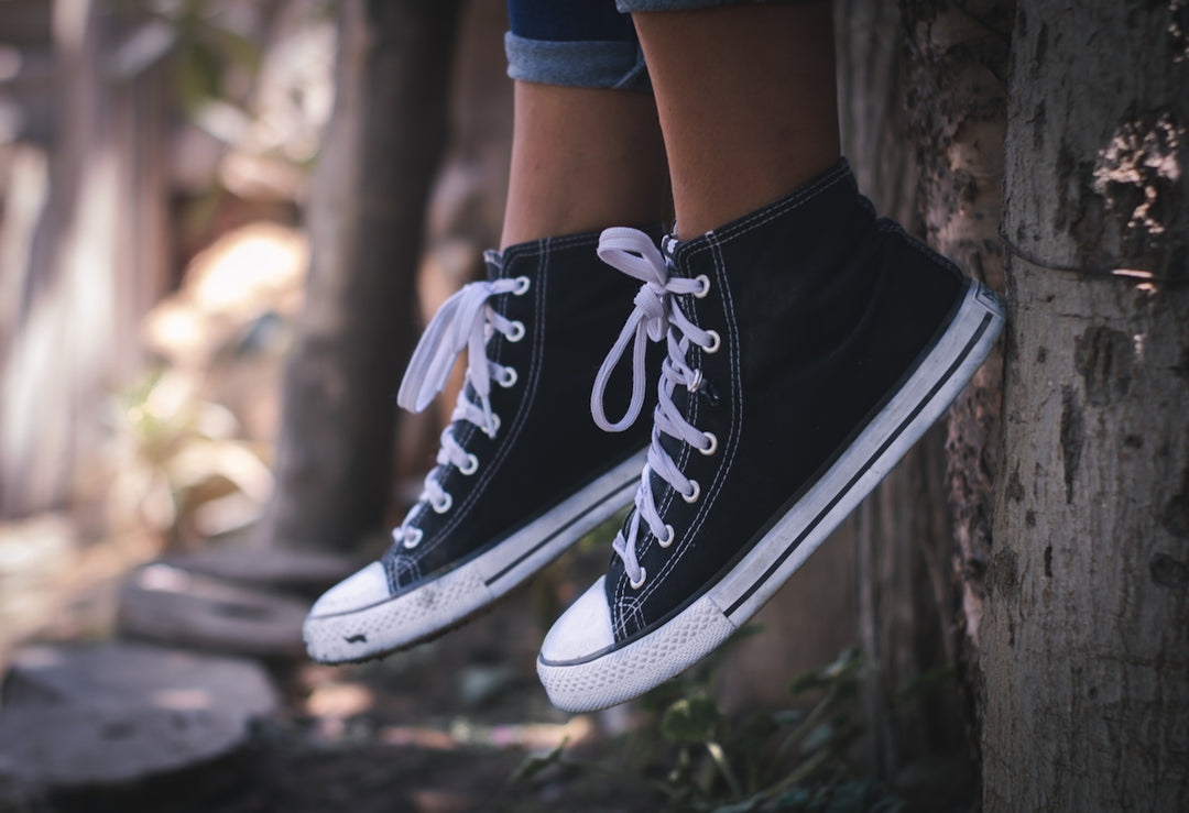 person in black-and-white high-top sneakers