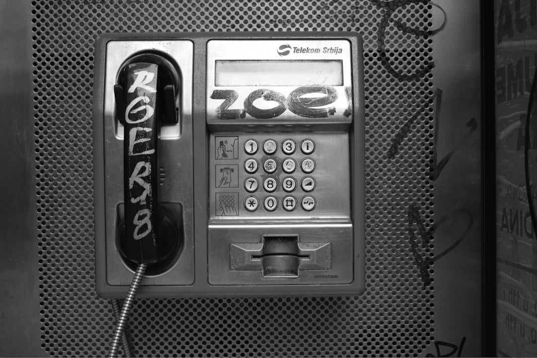 black and silver telephone booth