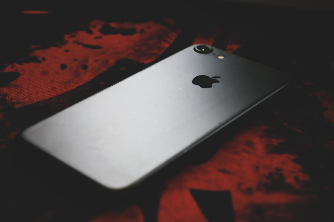 silver iphone 6 on red textile