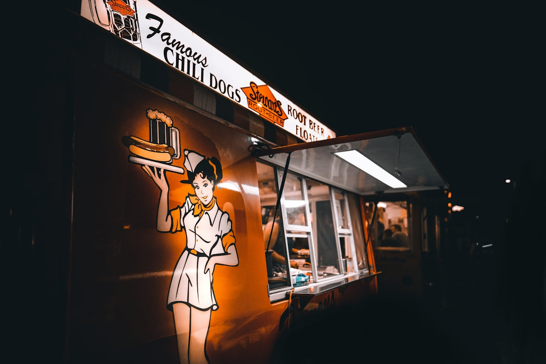 man in black suit jacket standing in front of store