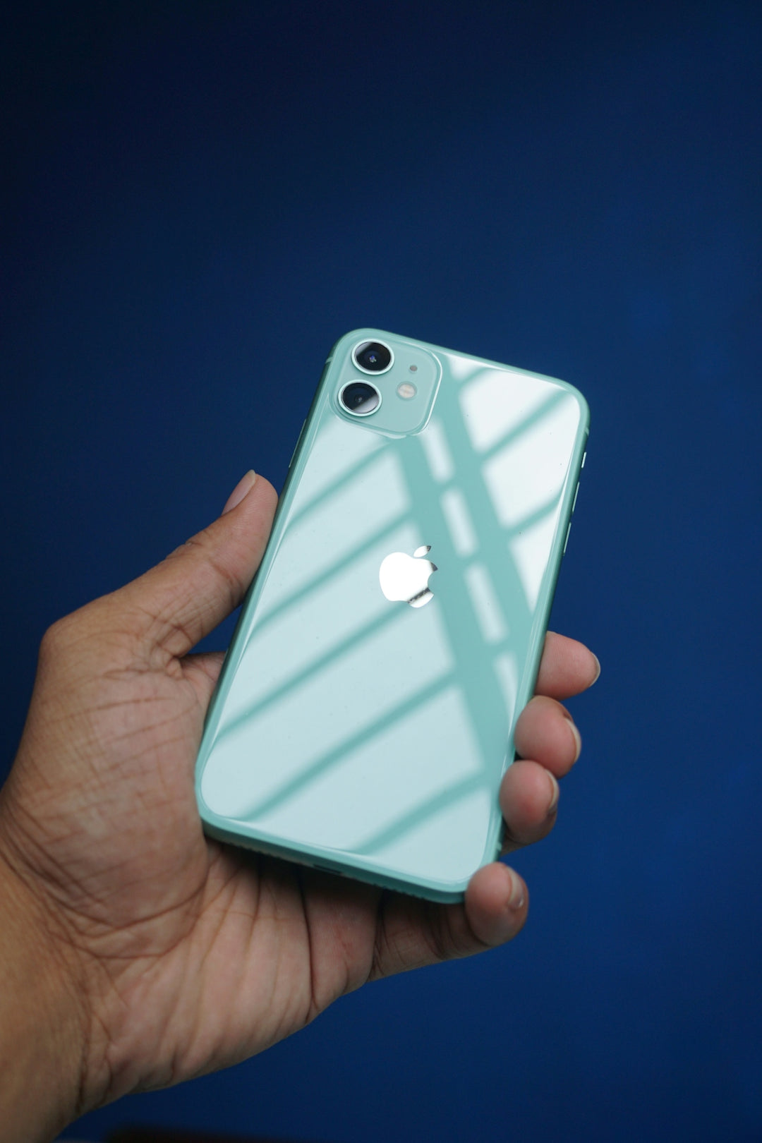 a person holding an iphone in their hand