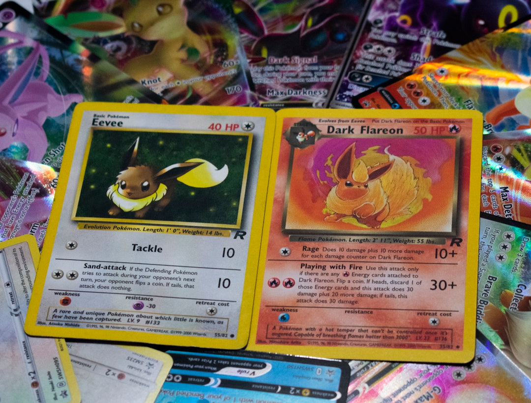 a pile of pokemon cards sitting on top of a table