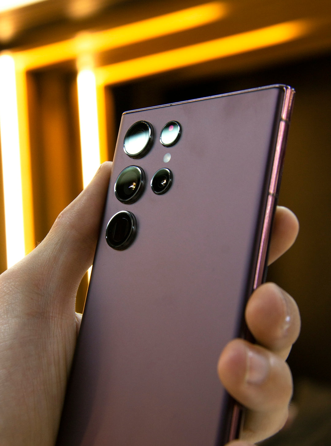 a close up of a person holding a cell phone
