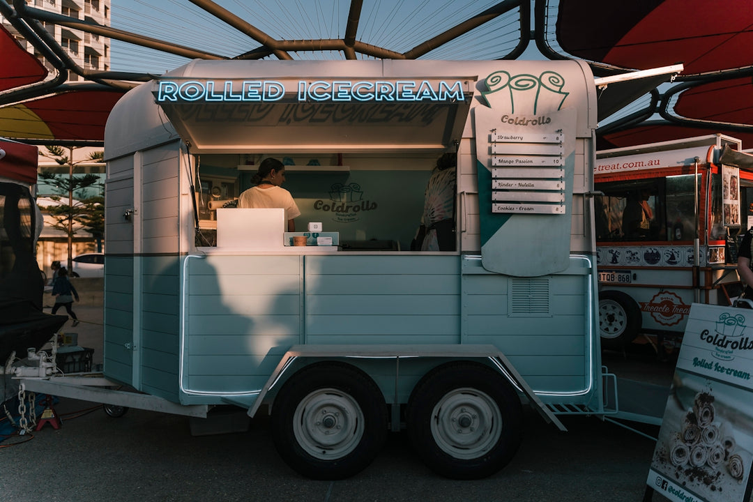 a food truck is parked under a canopy