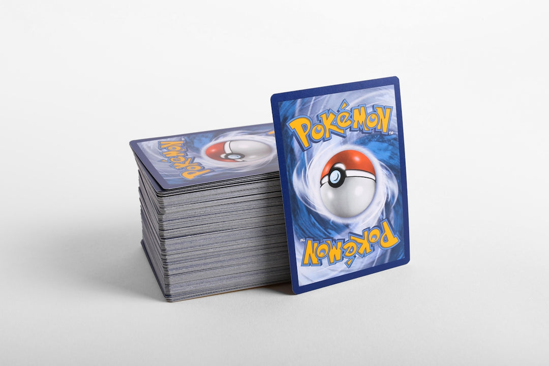 a stack of pokemon cards sitting on top of each other