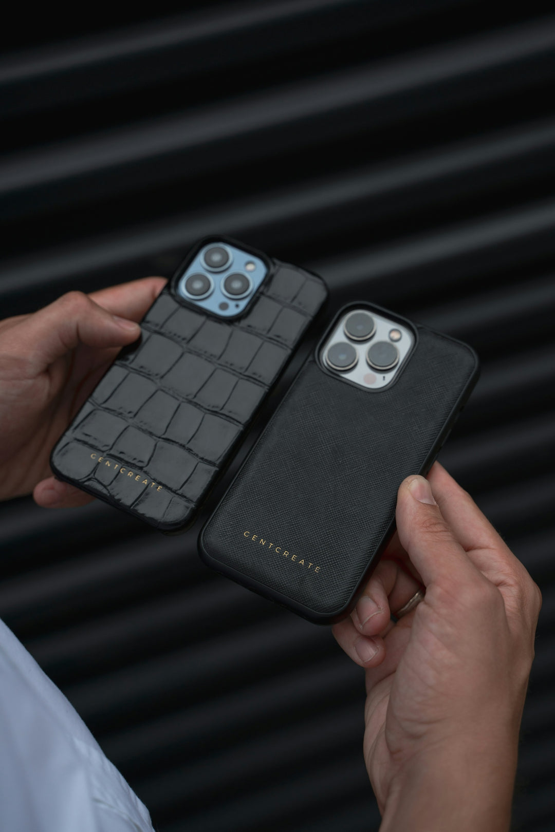 a person holding an iphone case in their hand