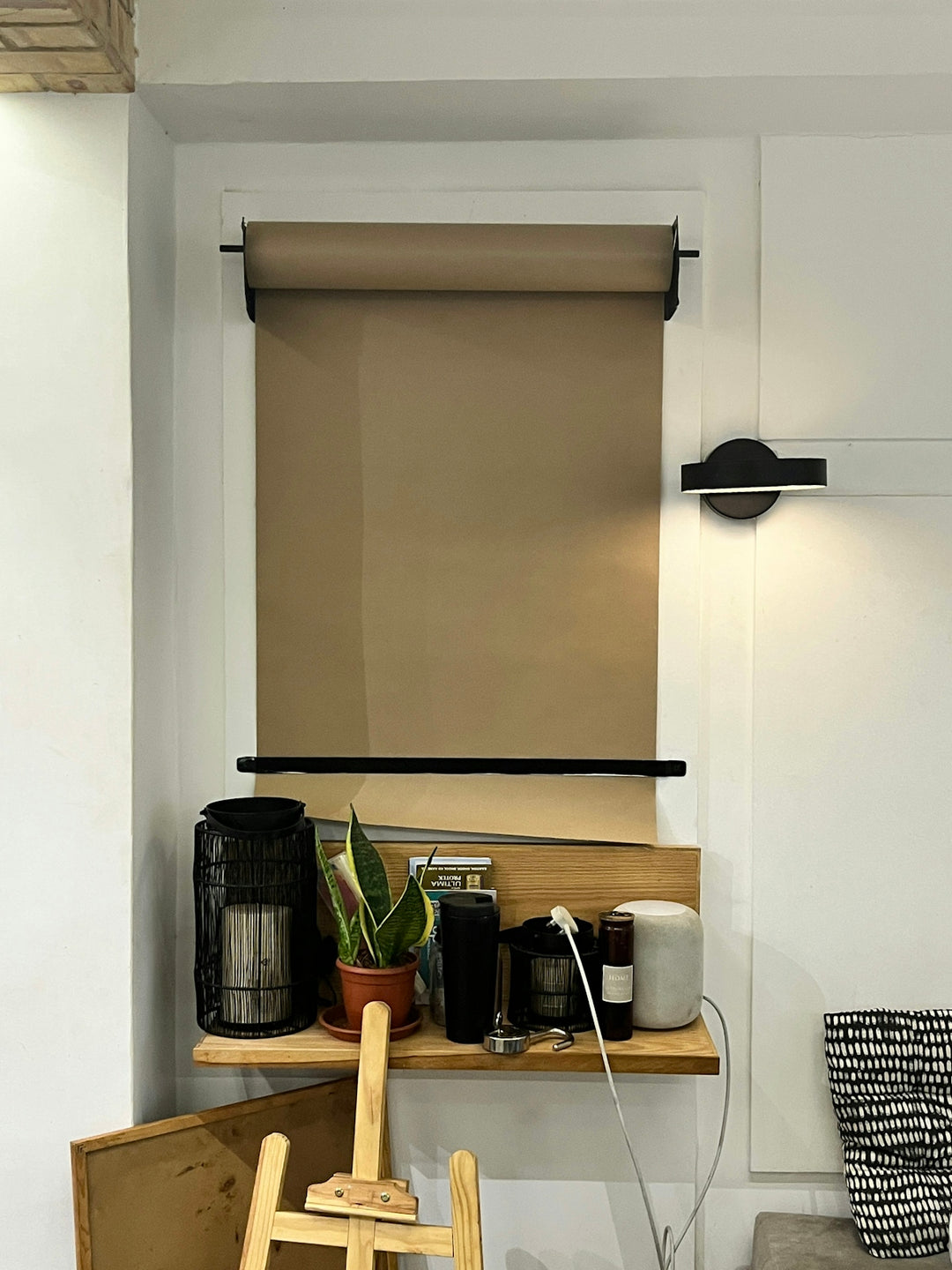 a room with a chair and a shelf with items on it