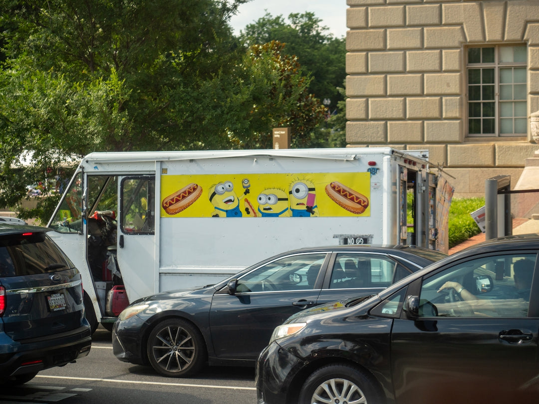 A fast food truck driving down a city street