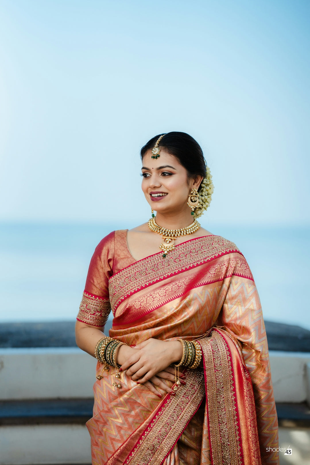 A woman in a sari posing for a picture