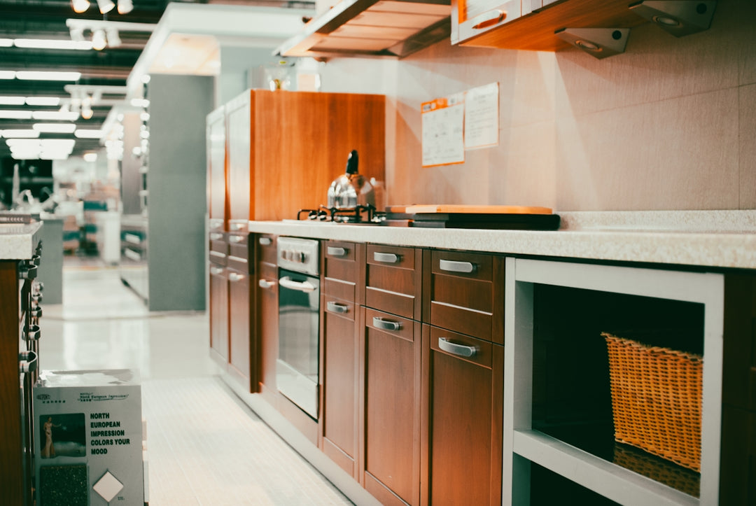 A kitchen filled with lots of wooden cabinets