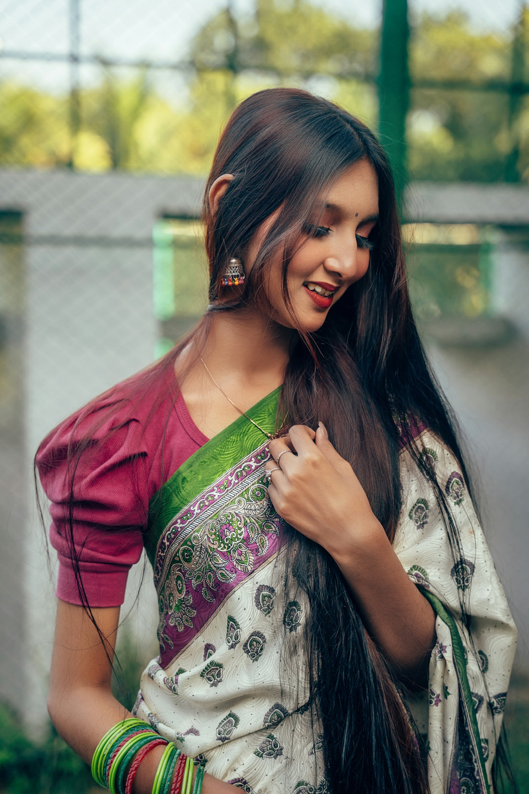 A woman with long hair wearing a sari