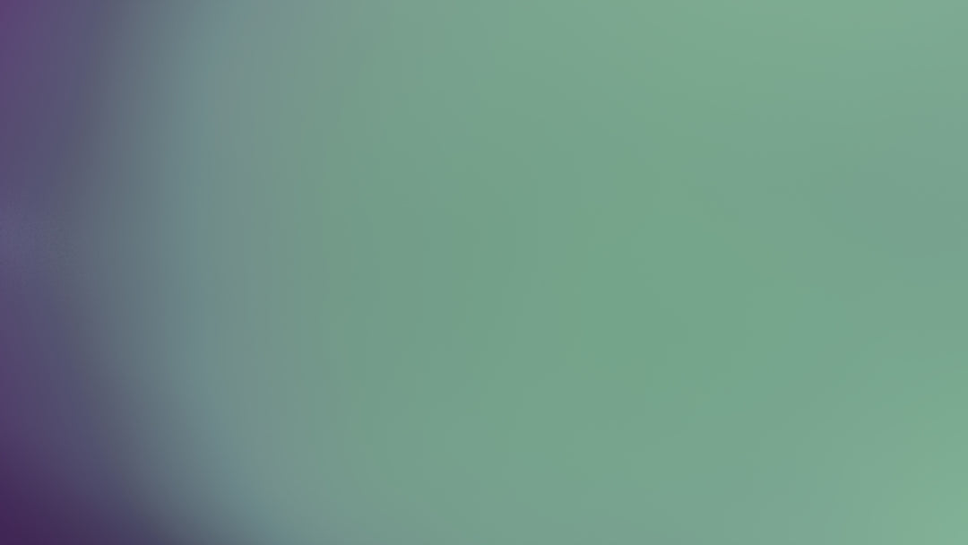 Blurred purple and green background.