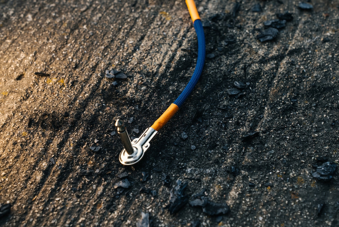 A cable is connected to a metal surface.