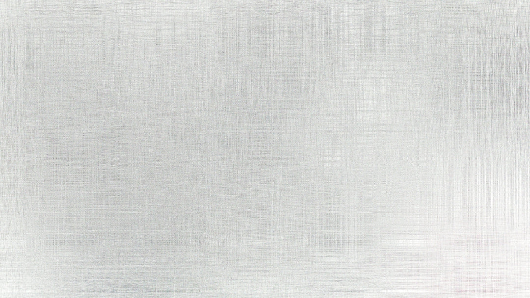 A brushed metal surface with subtle texture.