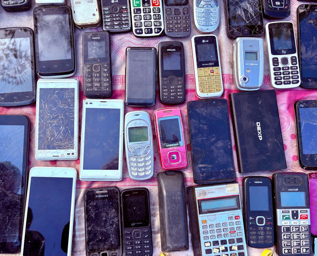 A collection of various old mobile phones and devices.