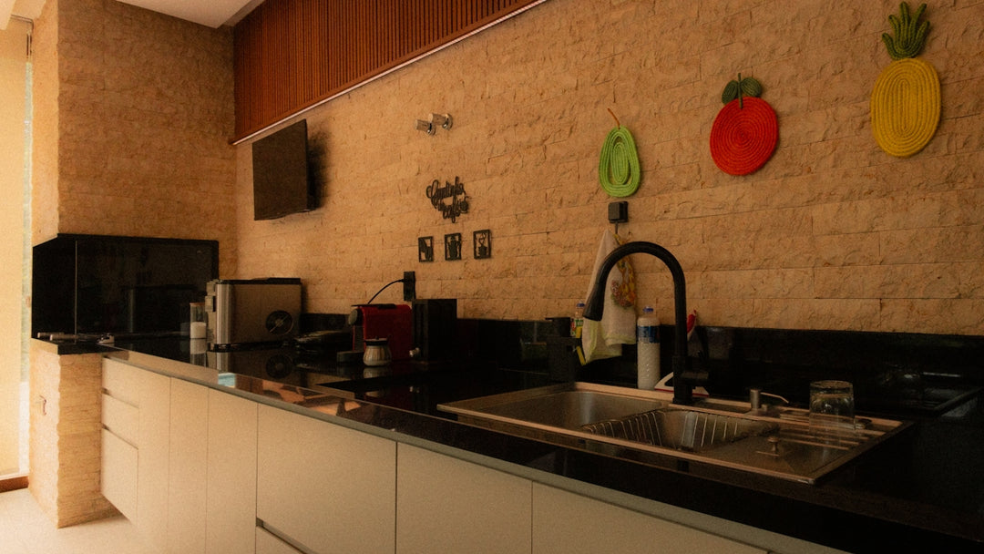 Modern kitchen counter with sink and appliances.