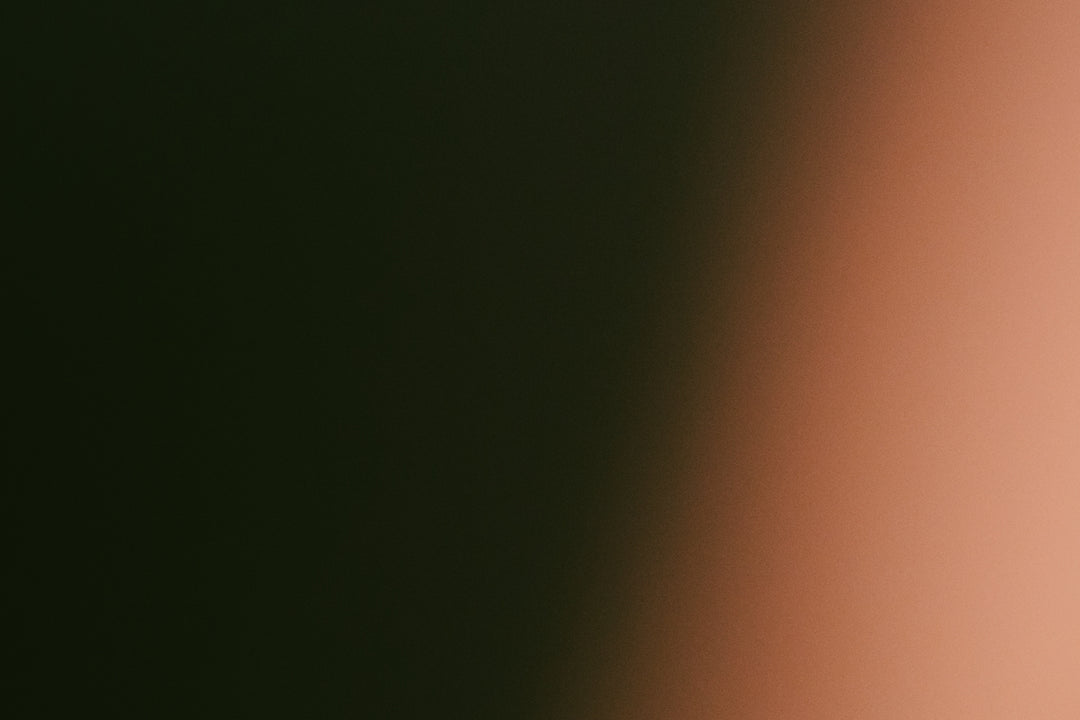 Dark green fading to light orange gradient