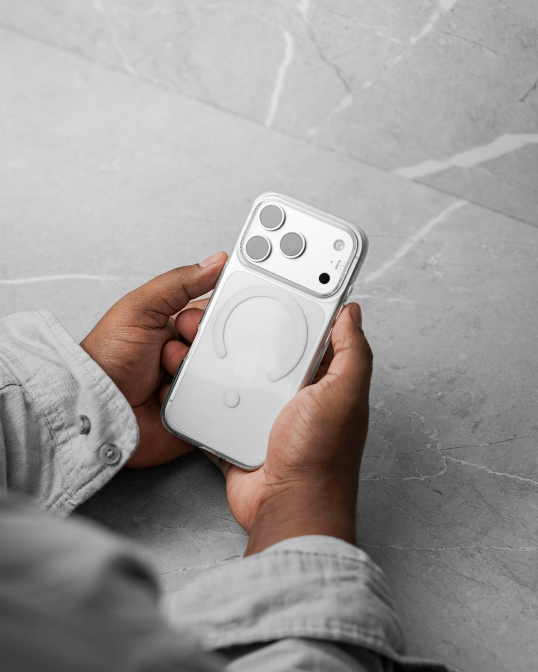 Hands holding a clear smartphone case