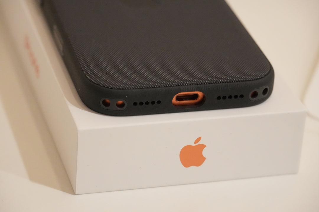 Black phone case on white apple box