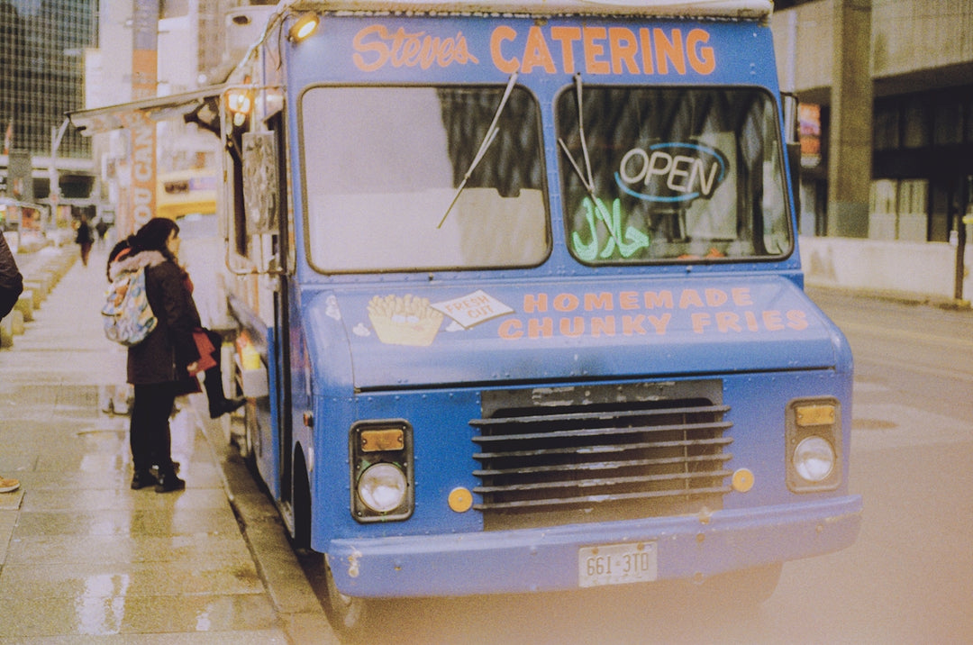 Blue food truck selling homemade fries