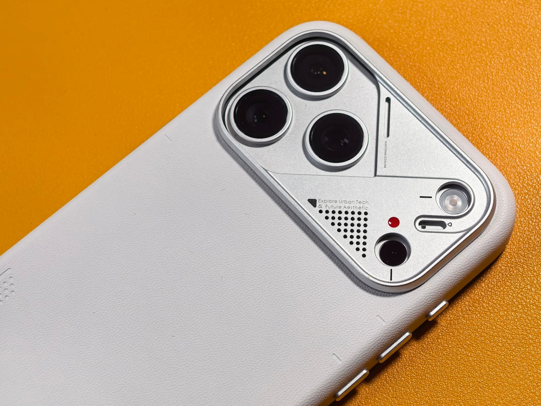Close-up of a white phone case with multiple camera lenses.