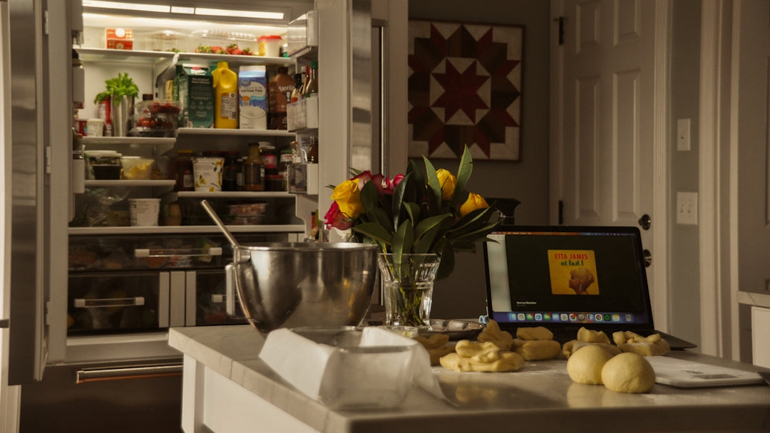 Kitchen counter with baking ingredients and open pantry