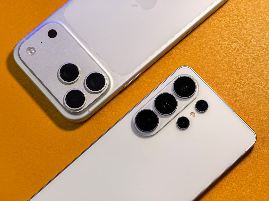 Two white smartphones with multiple camera lenses.