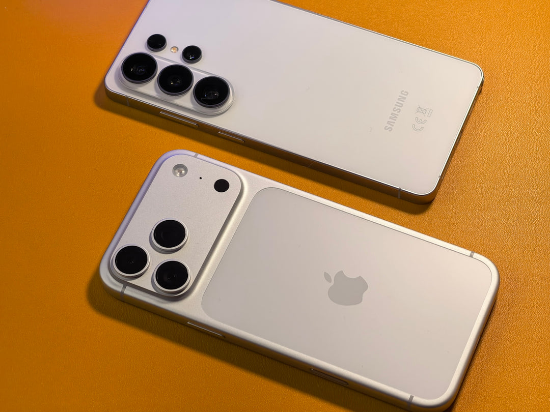 Two white smartphones with multiple cameras