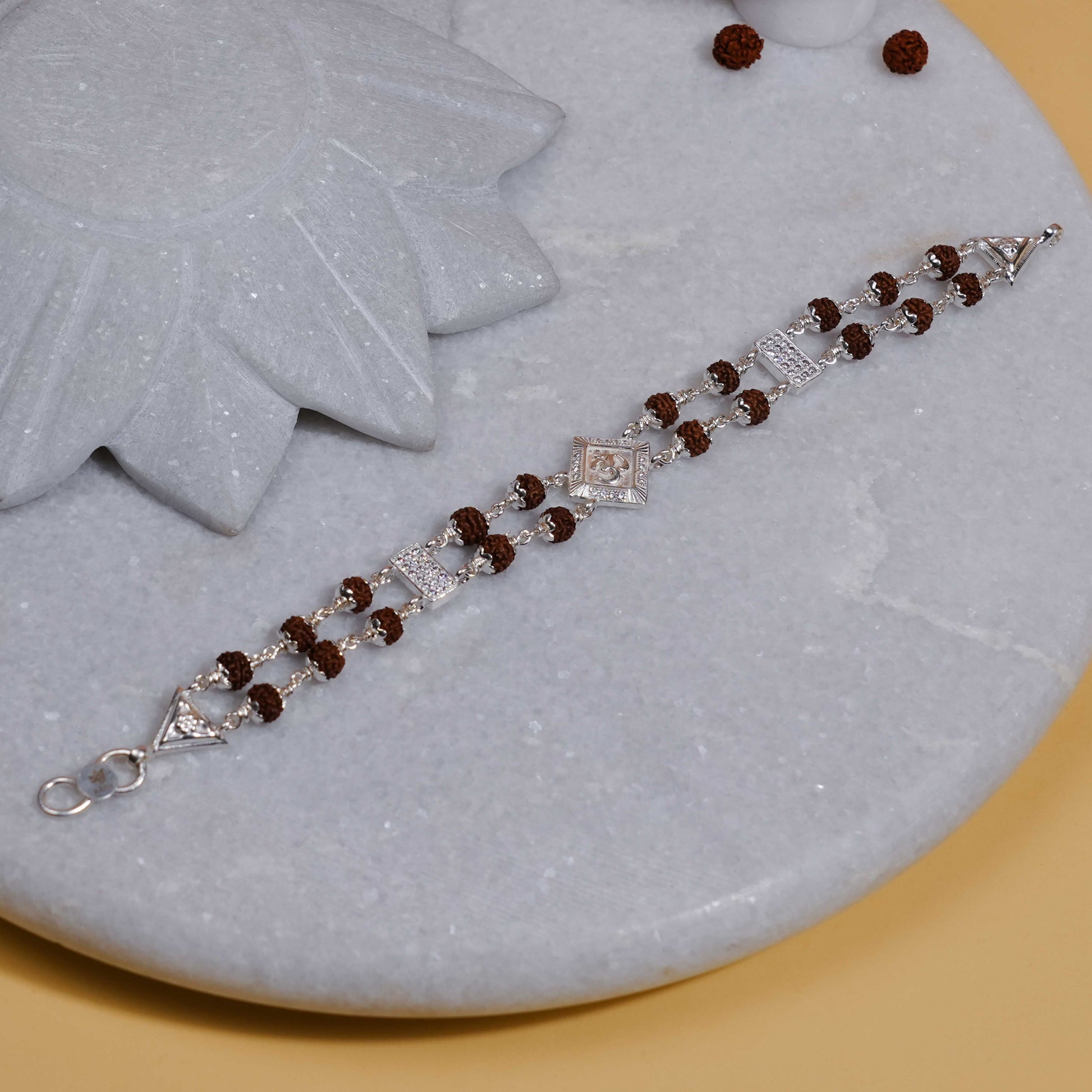 Silver Rakhi with Rudraksha, Om Brooch, Double Line Bracelet