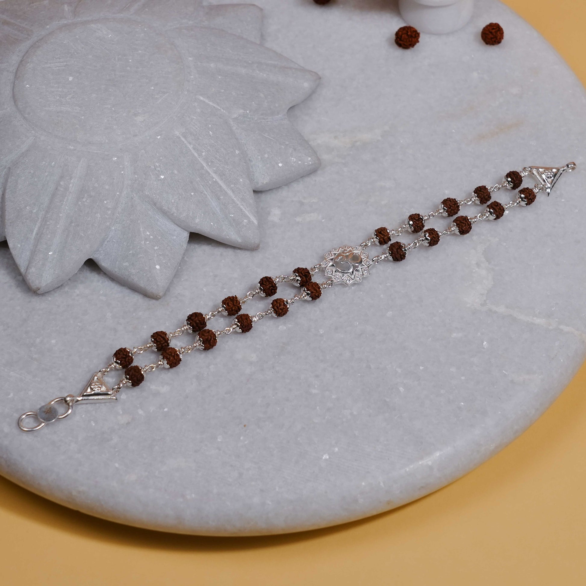 Silver Rakhi with Rudraksha, Om Flower Design, Double Line Bracelet