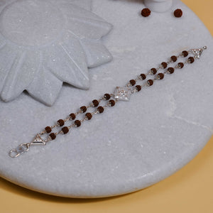 Silver Rakhi with Rudraksha, Om, and Rhombus Double Line Design