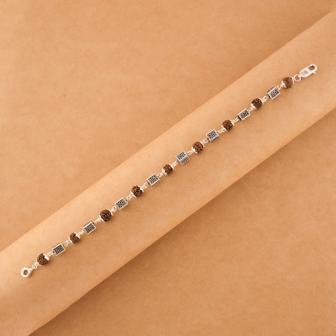Silver Rakhi with Square Cylinder Rudraksha Beads