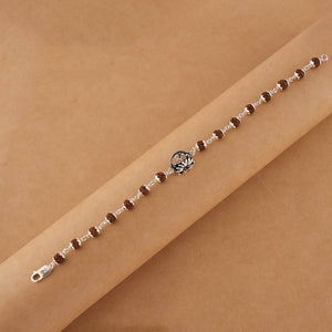 Silver Rakhi with Om and Lotus Flower and Single Line Rudraksha for Men
