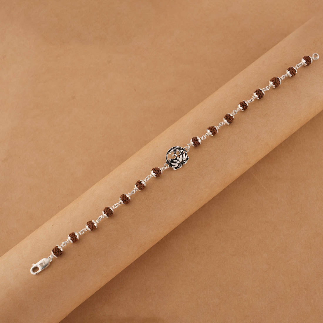 Silver Rakhi with Om and Lotus Flower and Single Line Rudraksha for Men