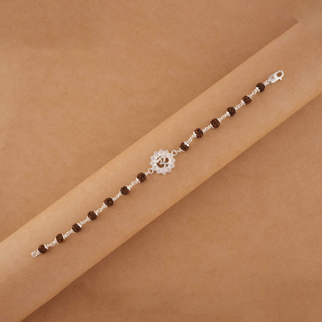 Rudraksha silver bracelet with Om in a concave sphere single line