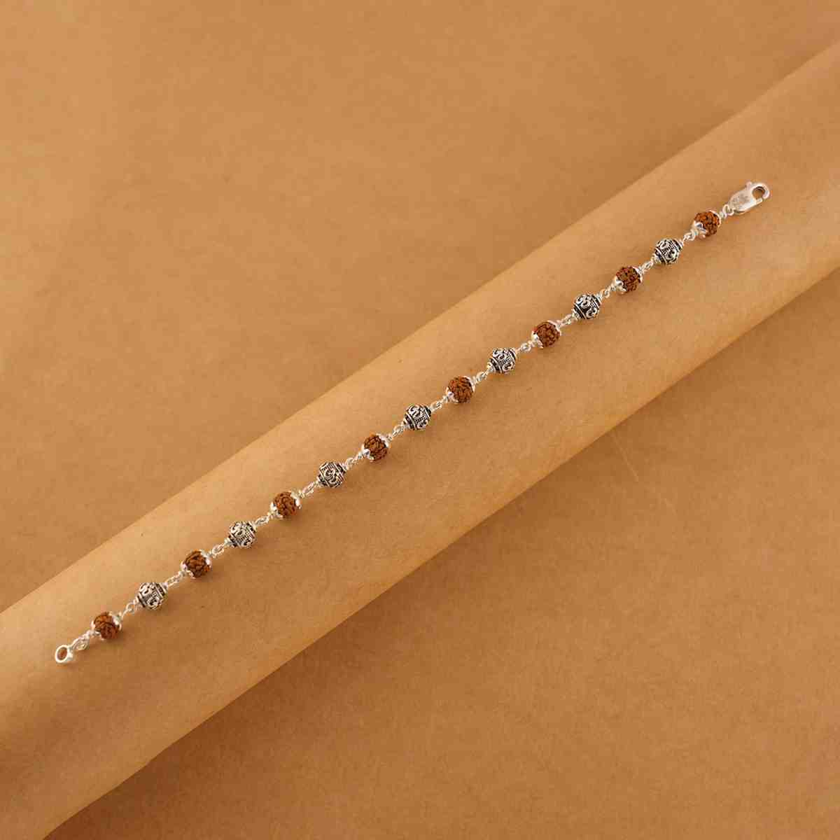 Silver Rakhi with Rudraksha and Om Beads
