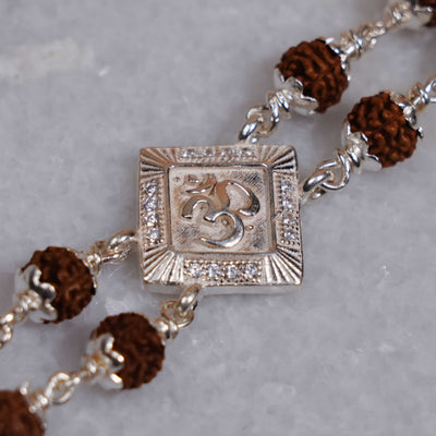 Silver Rakhi with Rudraksha, Om Brooch, Double Line Bracelet
