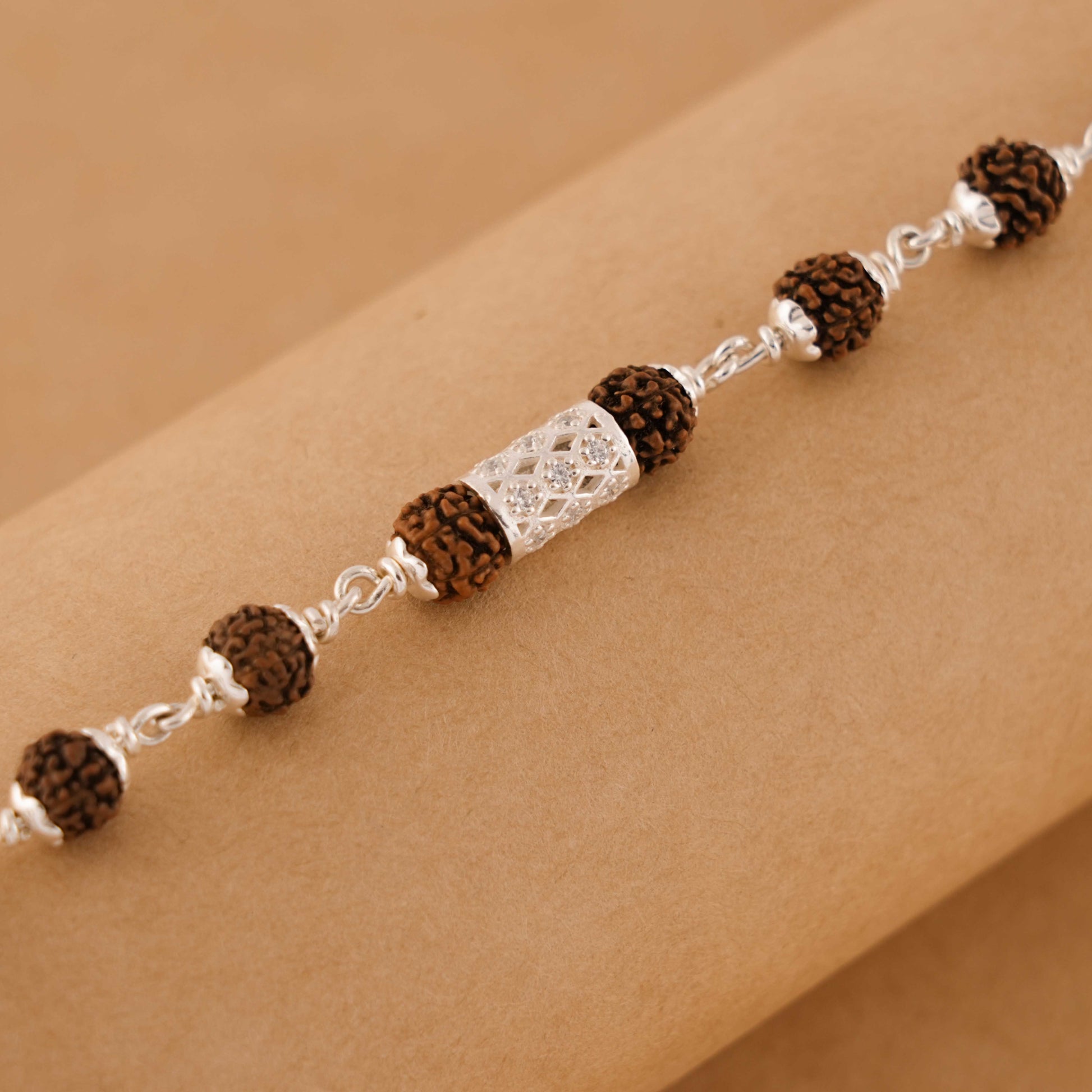 Silver Rakhi with Diamond Cylinder and Rudraksha