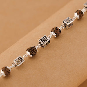 Silver Rakhi with Square Cylinder Rudraksha Beads