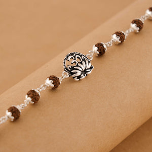 Silver Rakhi with Om and Lotus Flower and Single Line Rudraksha for Men