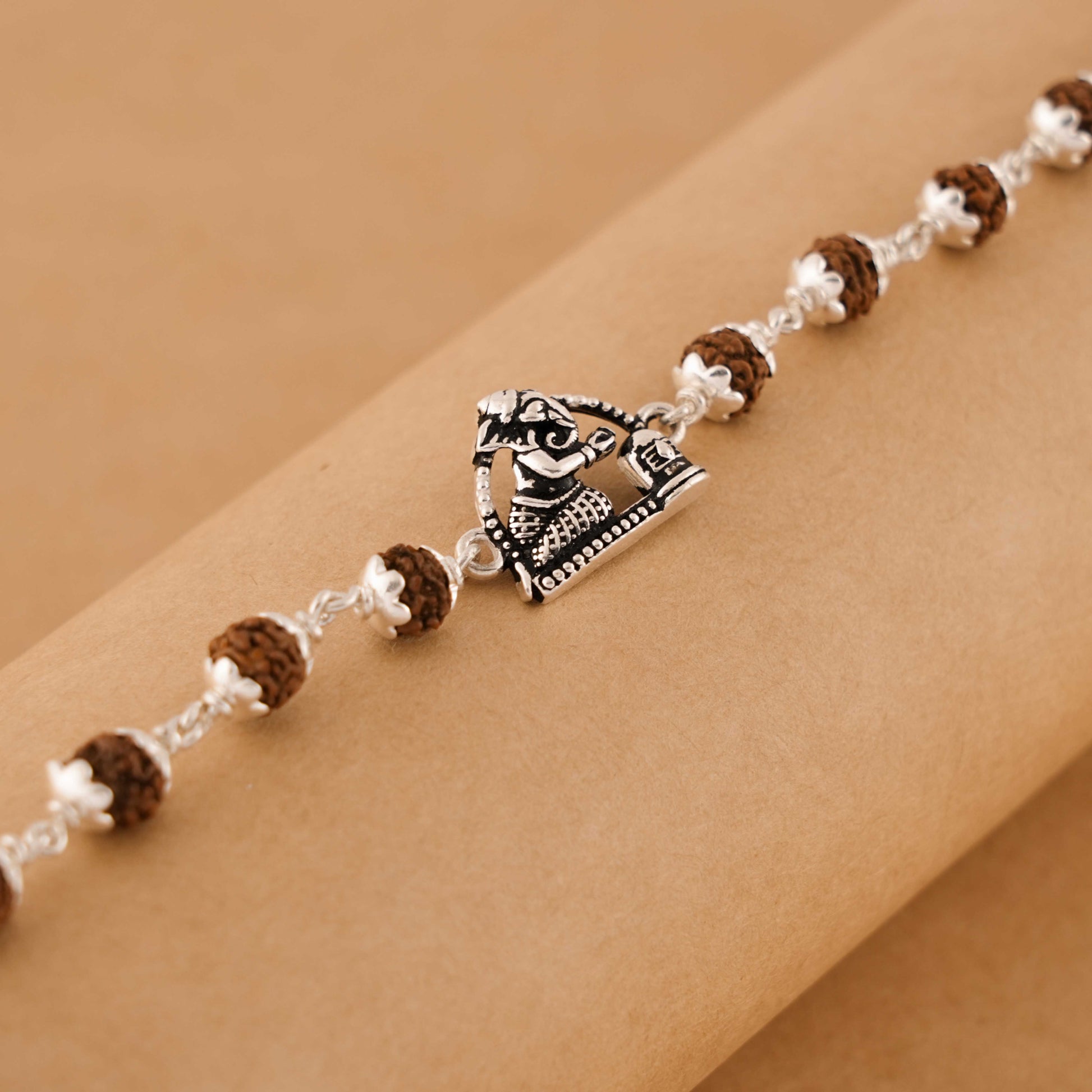 Silver Rakhi with Folded-Hand Ganesh