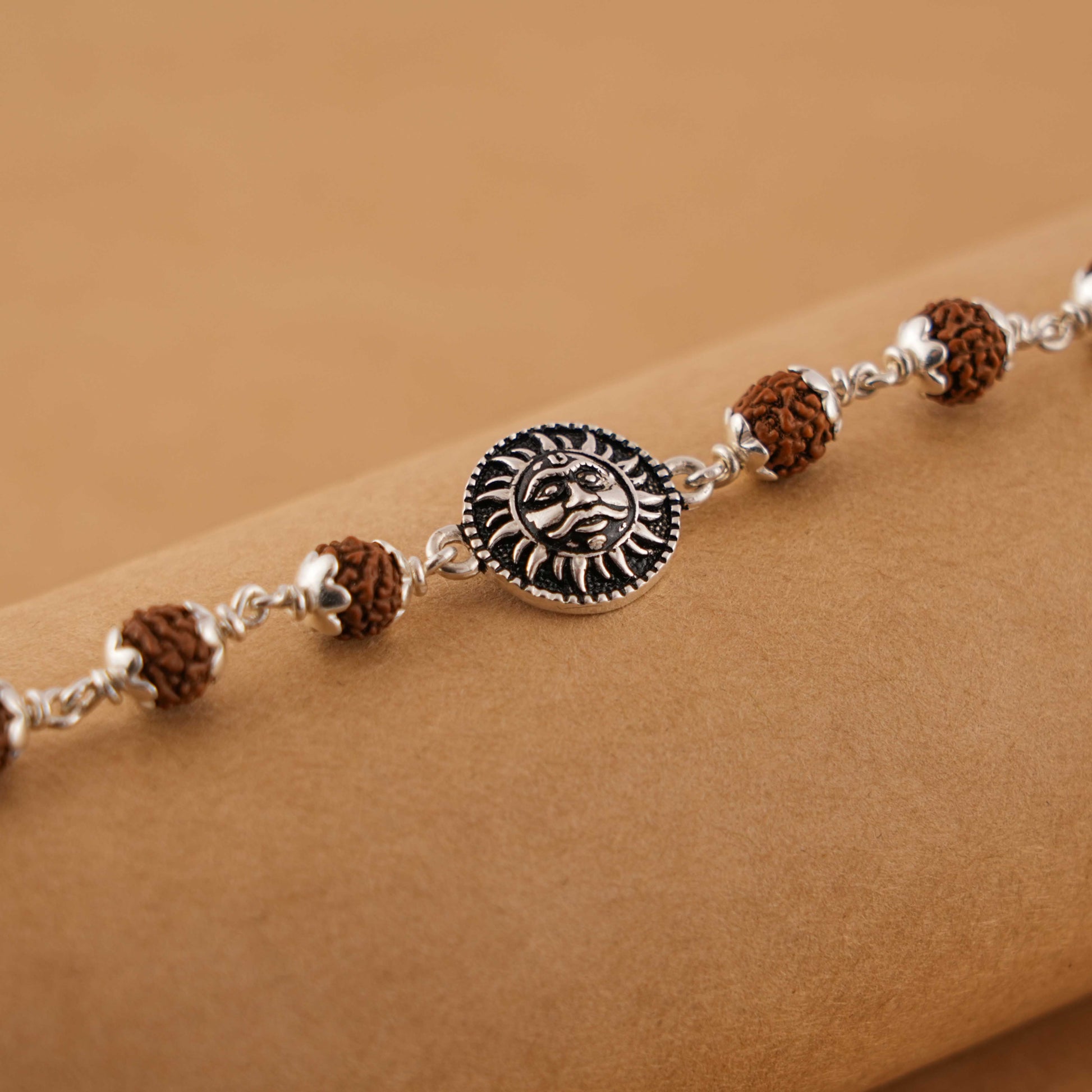 Silver Rakhi with Suryadev and Rudraksha