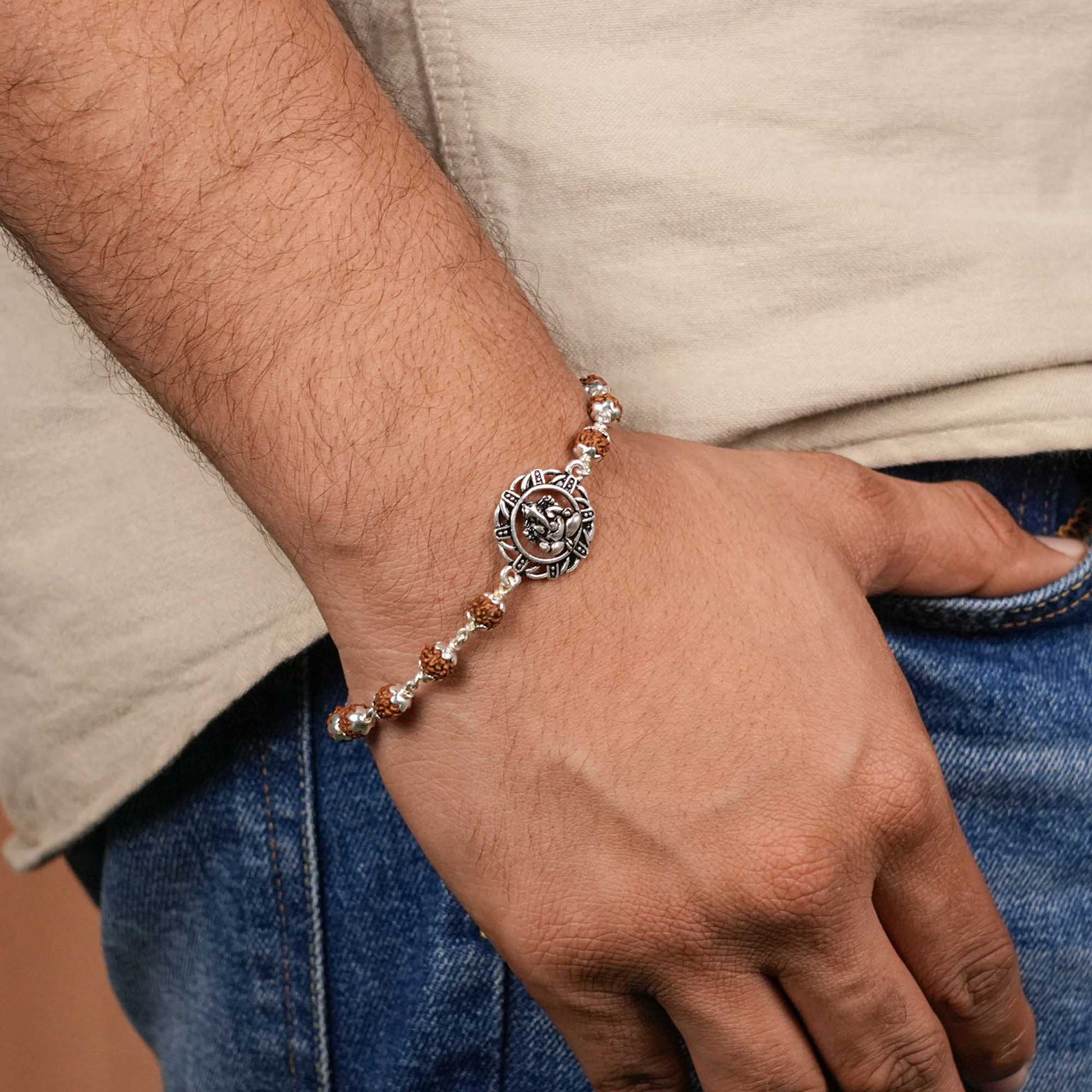 Rudraksha silver bracelet with Ganesh in a designer circular sphere single line