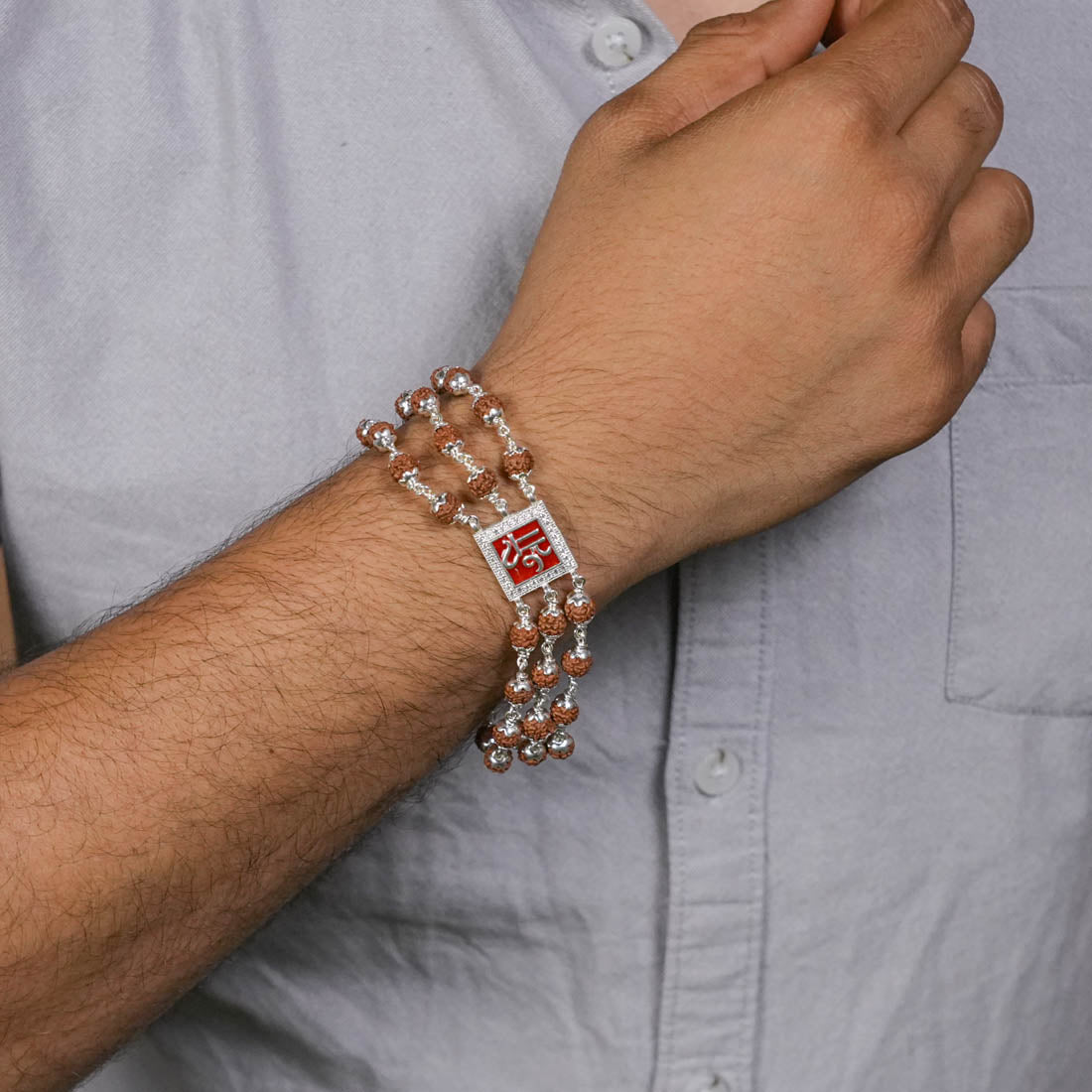 Rudraksha Silver Shree in Red Triple Line Bracelet