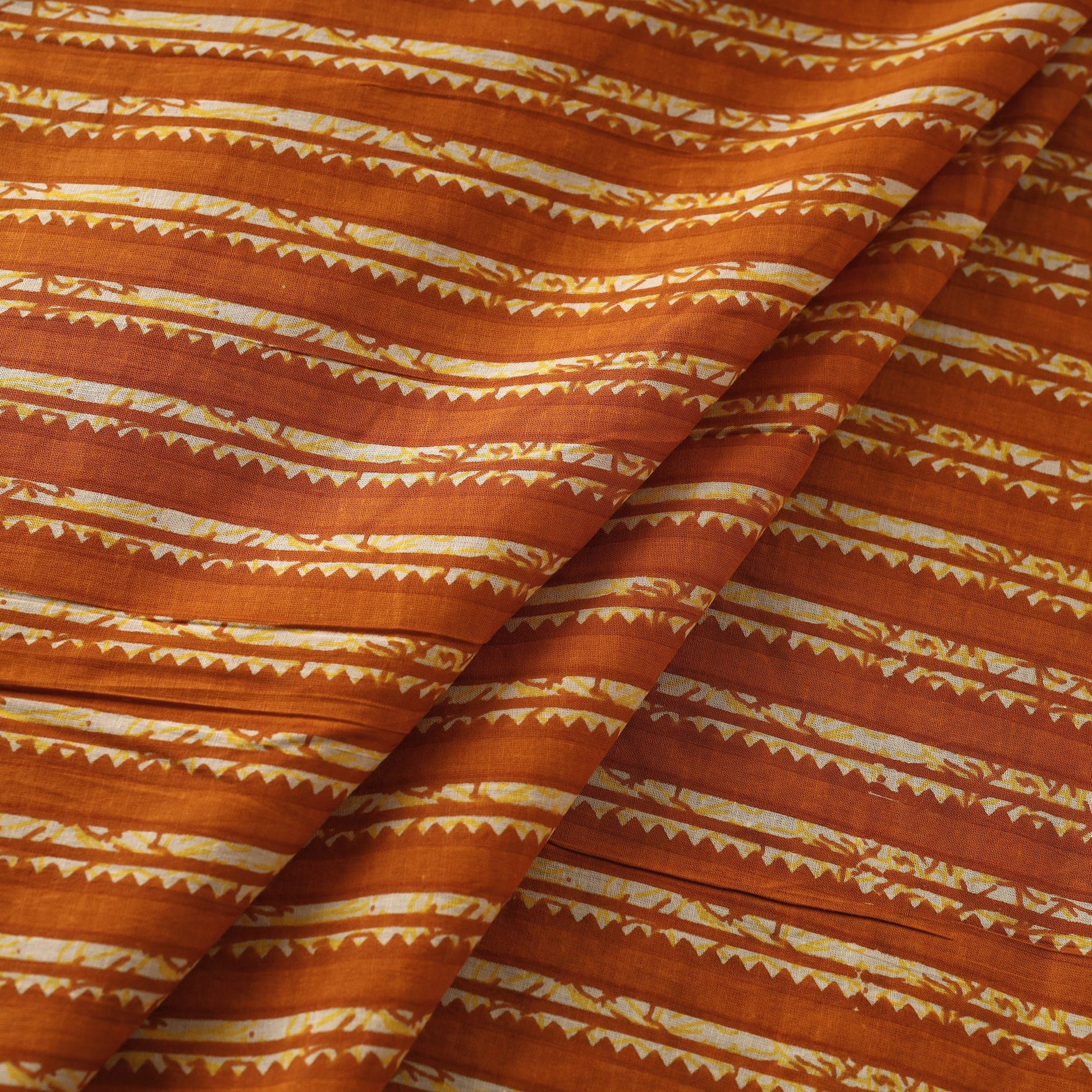 Alloy Orange In Stripes Jaipur Print Cotton Fabric