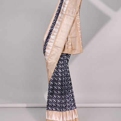 Blue intricate design ikkat saree with triangle motifs & geometric, floral motifs pallu