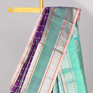 Purple floral motifs enclosed with checked kuppadam cotton saree with contrast zari border & pallu of argyle pattern