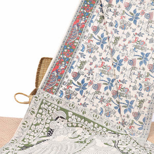 White village-theme machine-print kalamkari cotton saree, contrast floral creeper & peacock border & human figurines pallu
