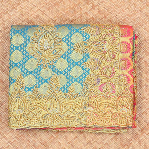 Blue embossed silksaree with stonework, contrast cutwork border & rich stonework pallu & unstitched aari blouse